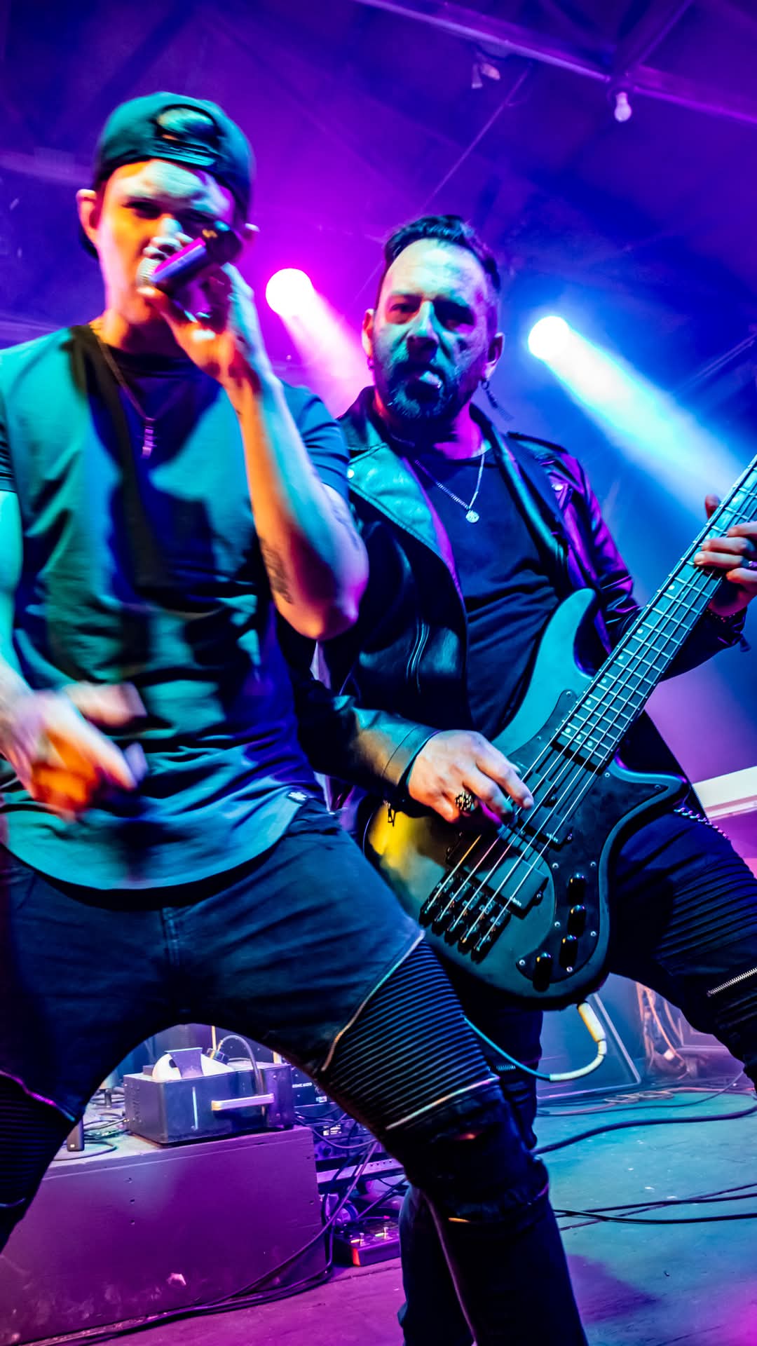 Vocalist and bassist performing side by side