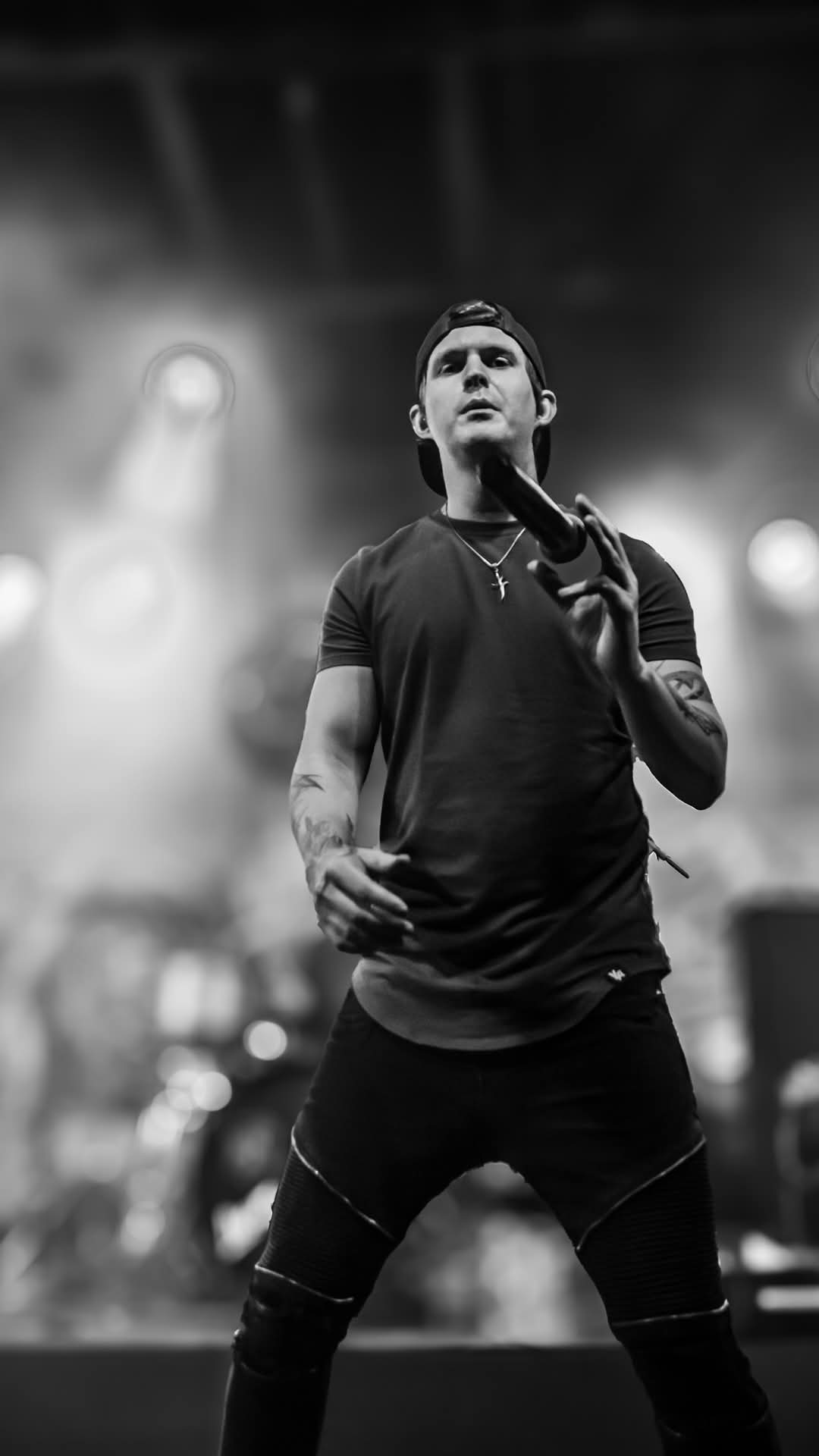 Vocalist tossing the mic in the air — black and white